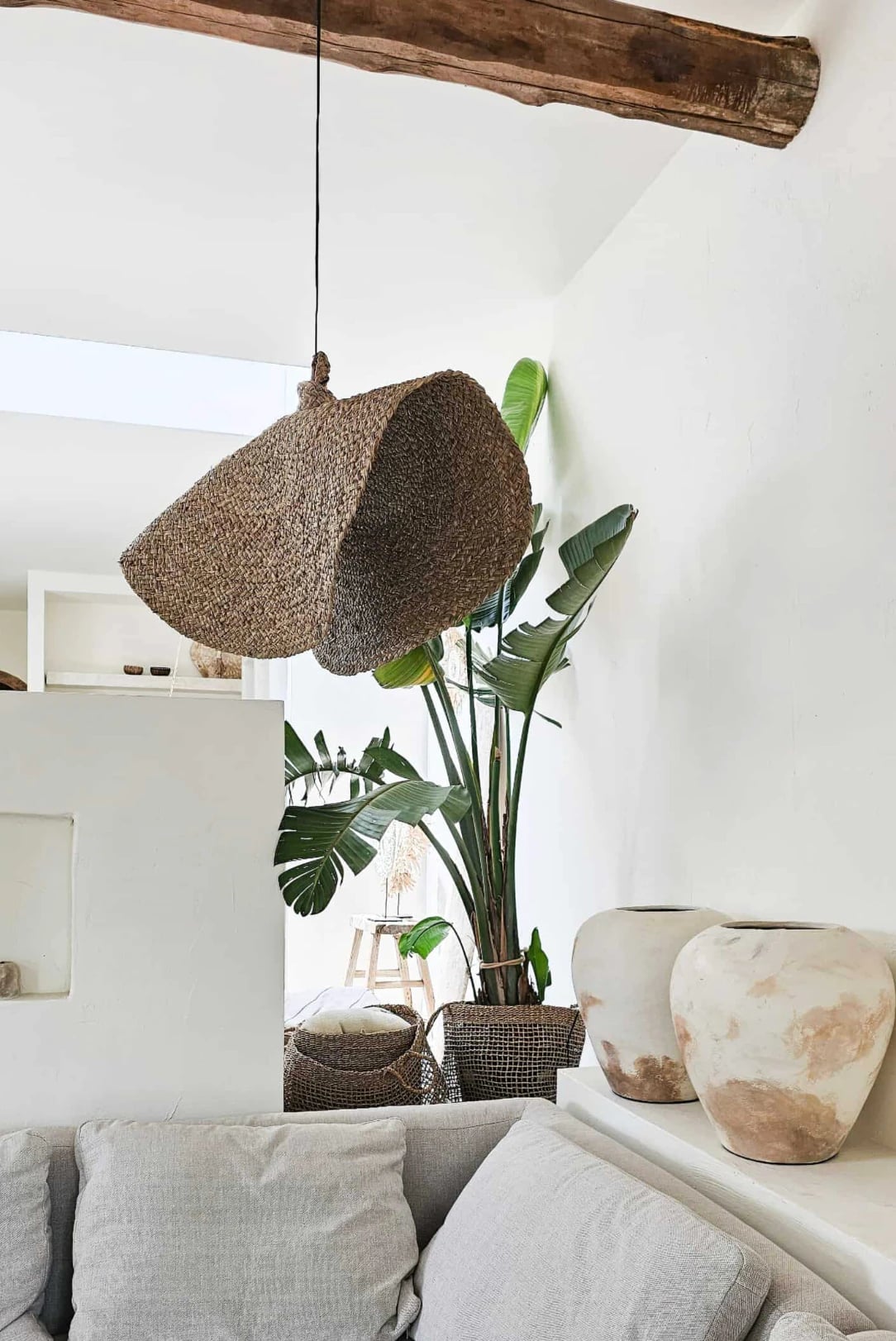 Handwoven reed pendant lamp with natural texture for Scandinavian interior