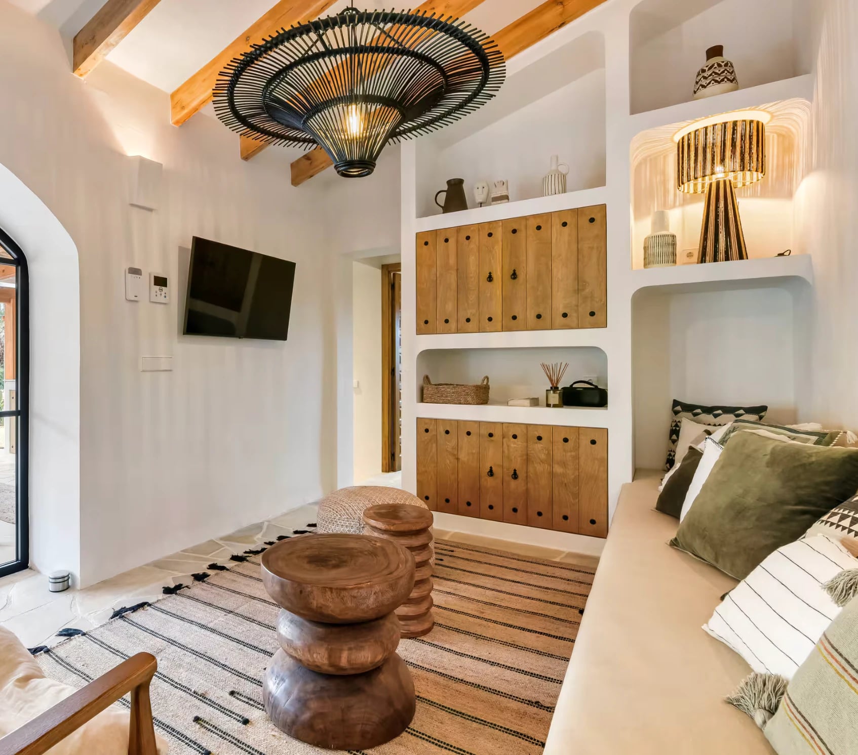Woven wicker ceiling lamp with openwork pattern and natural texture in Scandinavian interior
